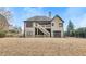 The house from the backyard has a spacious yard, a deck, and a staircase at 5810 Ripplestone Nw Ct, Acworth, GA 30101