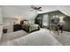 Comfortable bedroom with a ceiling fan, carpet flooring, neutral paint, and a home office setup at 5810 Ripplestone Nw Ct, Acworth, GA 30101