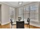Bright breakfast nook features a round glass table with seating and a door leading outside at 5810 Ripplestone Nw Ct, Acworth, GA 30101