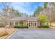 Exterior of the community clubhouse showing well-manicured landscaping and ample parking at 5810 Ripplestone Nw Ct, Acworth, GA 30101