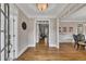 Bright foyer with hardwood floors, white trim, and decorative chair railing at 5810 Ripplestone Nw Ct, Acworth, GA 30101