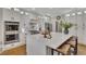 Modern kitchen with white cabinets, marble countertops, stainless steel appliances, and a breakfast bar at 5810 Ripplestone Nw Ct, Acworth, GA 30101