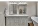 Bathroom featuring double sinks, modern fixtures, and neutral paint colors at 5810 Ripplestone Nw Ct, Acworth, GA 30101