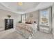 Bright main bedroom showcasing decor, large windows, and neutral paint colors at 5810 Ripplestone Nw Ct, Acworth, GA 30101