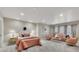 Spacious main bedroom with a sitting area, and a soft color palette for a relaxing ambiance at 5810 Ripplestone Nw Ct, Acworth, GA 30101