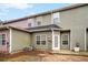 Back exterior view of a home with dual siding colors and backyard concrete patio at 6000 Suttles Sw Dr, Atlanta, GA 30331