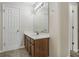 Bathroom with a modern vanity, large mirror, and ample lighting at 6000 Suttles Sw Dr, Atlanta, GA 30331