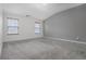 Bright bedroom with large windows, neutral walls, and plush gray carpet at 6000 Suttles Sw Dr, Atlanta, GA 30331