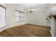 Bright dining room with hardwood floors, a modern chandelier, and access to the outdoors at 6000 Suttles Sw Dr, Atlanta, GA 30331