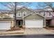 Charming townhome features a two-car garage and colorful, stylish exterior siding at 6000 Suttles Sw Dr, Atlanta, GA 30331