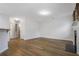Open-concept living room features hardwood floors, a fireplace, and ample natural light at 6000 Suttles Sw Dr, Atlanta, GA 30331