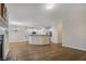Spacious, open living space featuring hardwood floors, a kitchen island, and fireplace at 6000 Suttles Sw Dr, Atlanta, GA 30331