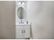 Modern powder room features a sleek vanity, round mirror, and stylish fixtures at 6000 Suttles Sw Dr, Atlanta, GA 30331