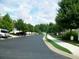 Scenic street view lined with lush trees and well-maintained sidewalks in a peaceful neighborhood at 6000 Suttles Sw Dr, Atlanta, GA 30331