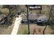Aerial view of a charming home with a long driveway and a spacious backyard in a peaceful residential area at 170 Dillard Ne Dr, Kennesaw, GA 30144