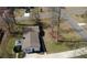 Aerial view of a cozy home featuring a well-maintained lawn and a long driveway on a quiet street at 170 Dillard Ne Dr, Kennesaw, GA 30144