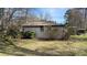 Spacious backyard with mature trees, offering plenty of room for outdoor activities and relaxation at 170 Dillard Ne Dr, Kennesaw, GA 30144