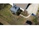 Aerial view of a backyard featuring a covered deck, manicured lawn, and a walkway to the driveway at 170 Dillard Ne Dr, Kennesaw, GA 30144
