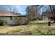 The spacious backyard features an expanse of green lawn and plenty of space for outdoor activities at 170 Dillard Ne Dr, Kennesaw, GA 30144