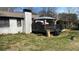 Charming home with a well-maintained backyard and a pergola-covered patio, ideal for outdoor gatherings at 170 Dillard Ne Dr, Kennesaw, GA 30144