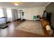 Finished basement featuring a home gym, entertainment area, and wood-look flooring at 170 Dillard Ne Dr, Kennesaw, GA 30144