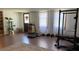 Finished basement featuring a home gym, laundry closet, and a back door at 170 Dillard Ne Dr, Kennesaw, GA 30144