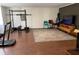 Finished basement featuring a home gym, entertainment area, and wood-look flooring at 170 Dillard Ne Dr, Kennesaw, GA 30144