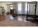 Finished basement featuring a home gym, laundry closet, and a back door at 170 Dillard Ne Dr, Kennesaw, GA 30144
