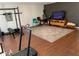 Finished basement featuring a home gym, entertainment area, and wood-look flooring at 170 Dillard Ne Dr, Kennesaw, GA 30144
