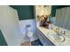 Bathroom featuring shower, toilet, and double sinks with storage at 170 Dillard Ne Dr, Kennesaw, GA 30144