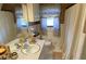 Traditional bathroom design with a double sink vanity, tiled walls, and decorative shower curtain, creating a functional space at 170 Dillard Ne Dr, Kennesaw, GA 30144