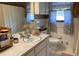 Traditional bathroom design with a double sink vanity, tiled walls, and decorative shower curtain, creating a functional space at 170 Dillard Ne Dr, Kennesaw, GA 30144