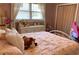 This bedroom features a pink-themed decor, creating a cute and comforting space with plenty of natural light from the window at 170 Dillard Ne Dr, Kennesaw, GA 30144