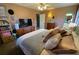 Stylish bedroom with wooden dresser, TV, and inviting bed at 170 Dillard Ne Dr, Kennesaw, GA 30144
