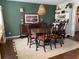 Traditional dining room showcasing dark wood furniture, complemented by a neutral rug, creating a warm, inviting atmosphere at 170 Dillard Ne Dr, Kennesaw, GA 30144
