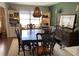 Dining room features a large wood table with seating, built-in bookcases, and a decorative light fixture at 170 Dillard Ne Dr, Kennesaw, GA 30144