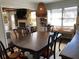 Dining room features a large dark wood table and unique hanging light fixture at 170 Dillard Ne Dr, Kennesaw, GA 30144