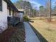 A charming white brick home featuring a cozy front porch and well-maintained landscaping at 170 Dillard Ne Dr, Kennesaw, GA 30144