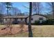 Charming home with manicured lawn, mature trees, and a welcoming front porch at 170 Dillard Ne Dr, Kennesaw, GA 30144