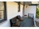 Covered front porch featuring comfortable seating, creating a warm and inviting entrance to the home at 170 Dillard Ne Dr, Kennesaw, GA 30144