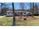 Charming ranch-style home with a beautifully landscaped front yard and a well-maintained lawn at 170 Dillard Ne Dr, Kennesaw, GA 30144