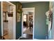 Hallway featuring decorative touches and views into the living spaces at 170 Dillard Ne Dr, Kennesaw, GA 30144