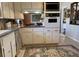Well-lit kitchen with vintage appliances and a view into the living areas at 170 Dillard Ne Dr, Kennesaw, GA 30144