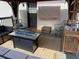Inviting patio featuring comfortable seating, stylish rugs, and a cozy fire pit, perfect for relaxing or entertaining at 170 Dillard Ne Dr, Kennesaw, GA 30144