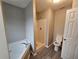 Bathroom with tub, shower, and toilet, showcasing modern fixtures and finishes at 2612 Halligan Pointe, Riverdale, GA 30296