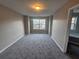 Bright bedroom with large window and neutral carpet at 2612 Halligan Pointe, Riverdale, GA 30296