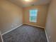 Small bedroom with a carpet and a window at 2612 Halligan Pointe, Riverdale, GA 30296