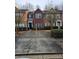 Charming townhome with a private driveway and well-maintained landscaping at 2612 Halligan Pointe, Riverdale, GA 30296