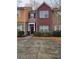 Charming townhome featuring brick and stone facade, complemented by well-maintained landscaping at 2612 Halligan Pointe, Riverdale, GA 30296