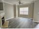 Bright living area featuring modern flooring, a fireplace, and plenty of natural light at 2612 Halligan Pointe, Riverdale, GA 30296